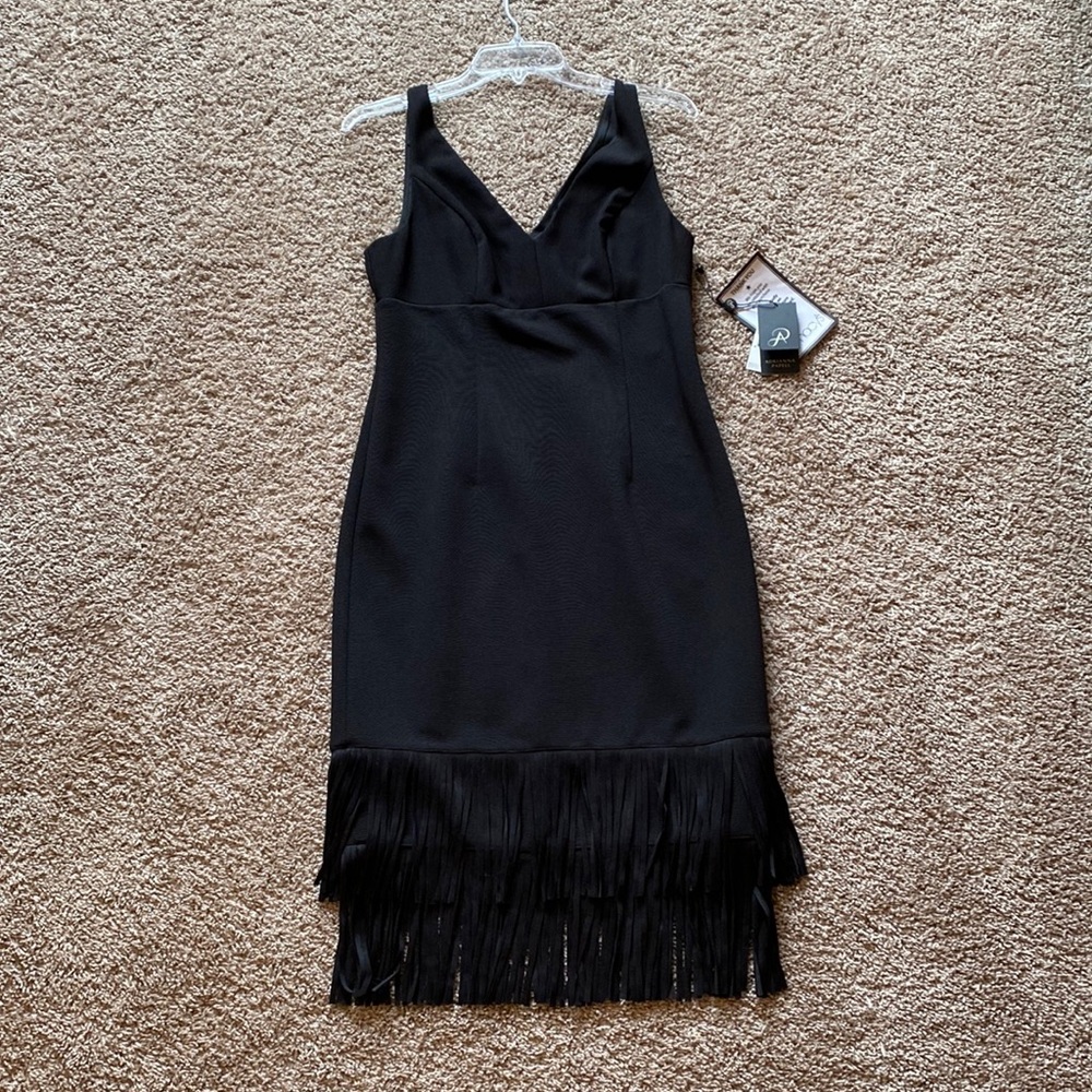 Sleeveless black dress with fringe
